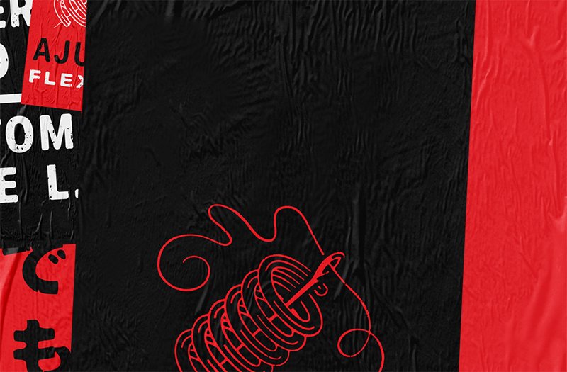 A black UA threadborne shift shoe against black and red graphics.