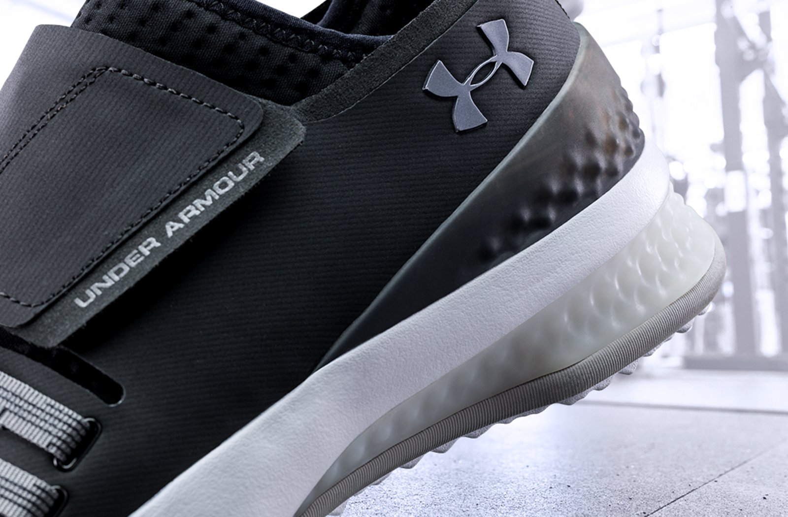 Close-up of the heel of the UA Architech Reach Training Shoes showing the webbed stability structure