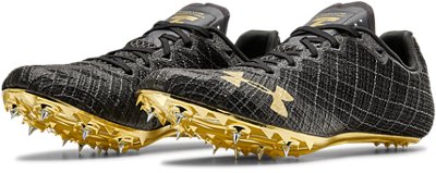 track spikes black and gold